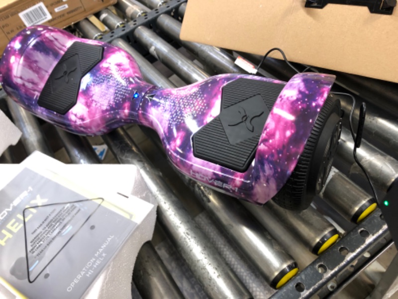 Photo 2 of Hover-1 Helix Electric Hoverboard | 7MPH Top Speed, 4 Mile Range, 6HR Full-Charge, Built-in Bluetooth Speaker, Rider Modes: Beginner to Expert Hoverboard Galaxy