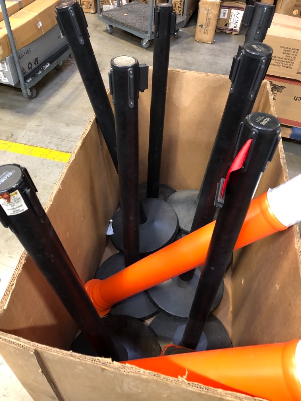 Photo 1 of 13 items ---uline eazy let go barrier line posts 8 posts -------spiral hose canister ------2 orange barrier posts missing bottoms and 2 orange safety cones ----view pictures 