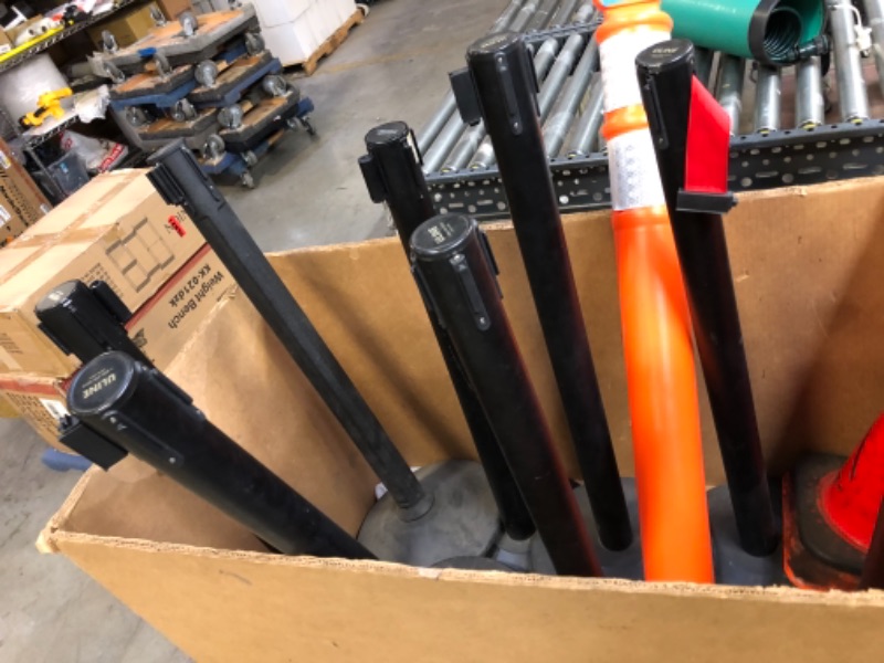 Photo 5 of 13 items ---uline eazy let go barrier line posts 8 posts -------spiral hose canister ------2 orange barrier posts missing bottoms and 2 orange safety cones ----view pictures 