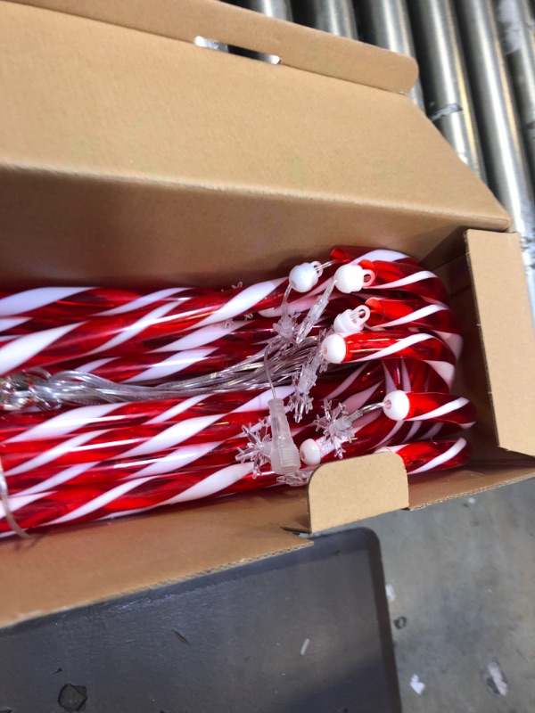 Photo 1 of Outside Christmas Decorations, 16 Pack 28” Candy Cane Lights Outdoor Pathway, Candy Cane Lights with Snowflake, 52ft in Length 160 LED Lights in Total, 30V Candy Cane Pathway Lights,Brighter and Safer
