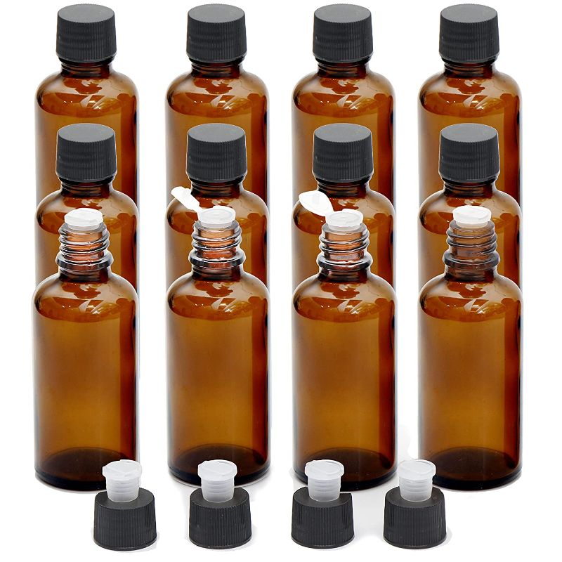 Photo 1 of  Essential Oils Bottles, 16 Pack 2 Ounce Amber Glass Vials Bottles with Orifice Reducers and Black Caps
