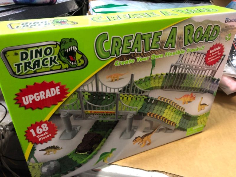 Photo 1 of Batlofty Dinosaur Toys Race Track, Flexible Track Playset, Create A Dinosaur World Road Race with 1 Dinosaur Car and 6 Dinosaur Toys for 3 4 5 6 7 Year Old Boys Girls Birthday Gifts Dinosaur Race Track