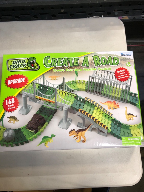 Photo 2 of Batlofty Dinosaur Toys Race Track, Flexible Track Playset, Create A Dinosaur World Road Race with 1 Dinosaur Car and 6 Dinosaur Toys for 3 4 5 6 7 Year Old Boys Girls Birthday Gifts Dinosaur Race Track