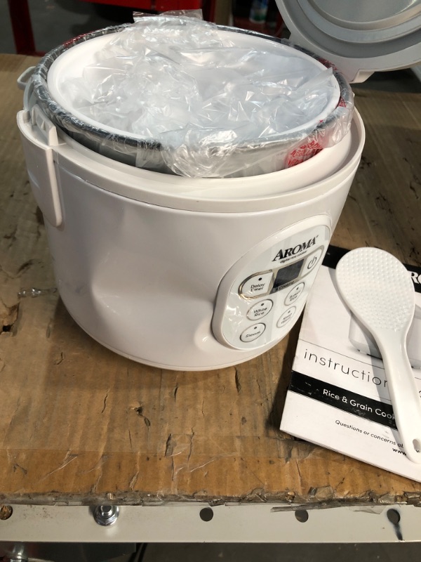 Photo 2 of * DAMAGED * 
Aroma Housewares 8-Cup (Cooked) (4-Cup UNCOOKED) Digital Rice Cooker and Food Steamer (ARC-914D),White