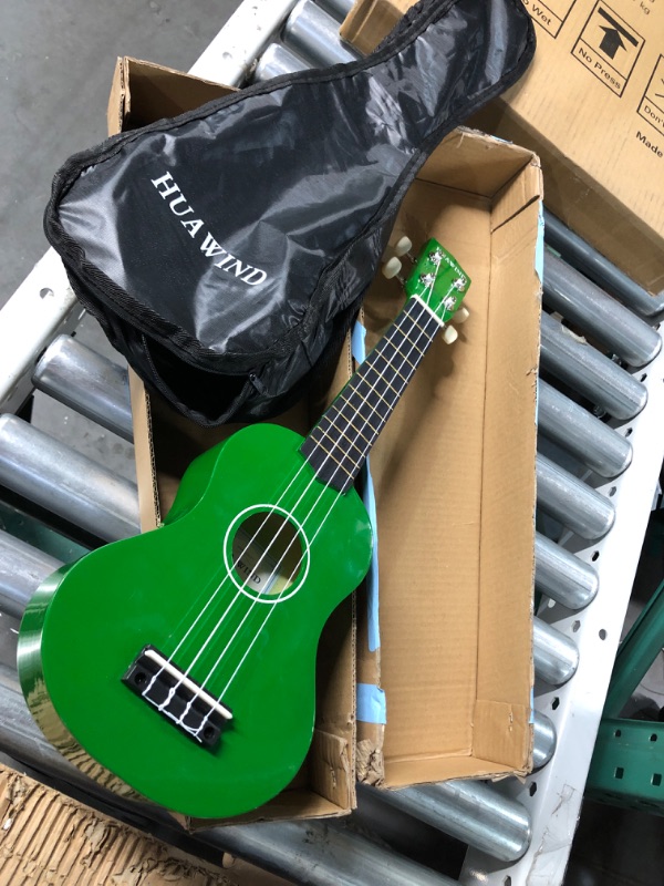 Photo 2 of *GENTLY USED* HUAWIND Kids Ukulele, 21 inch Soprano Ukulele, Four String Wood Uke with Gig Bag (Green) 