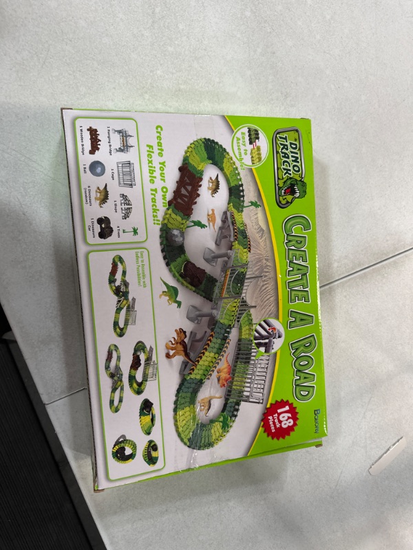 Photo 2 of Batlofty Dinosaur Toys Race Track, Flexible Track Playset, Create A Dinosaur World Road Race with 1 Dinosaur Car and 6 Dinosaur Toys for 3 4 5 6 7 Year Old Boys Girls Birthday Gifts Dinosaur Race Track