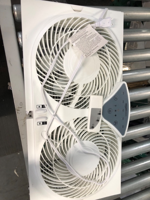 Photo 2 of Amazon Basics Window Fan with Manual Controls, Twin 9-Inch Blades