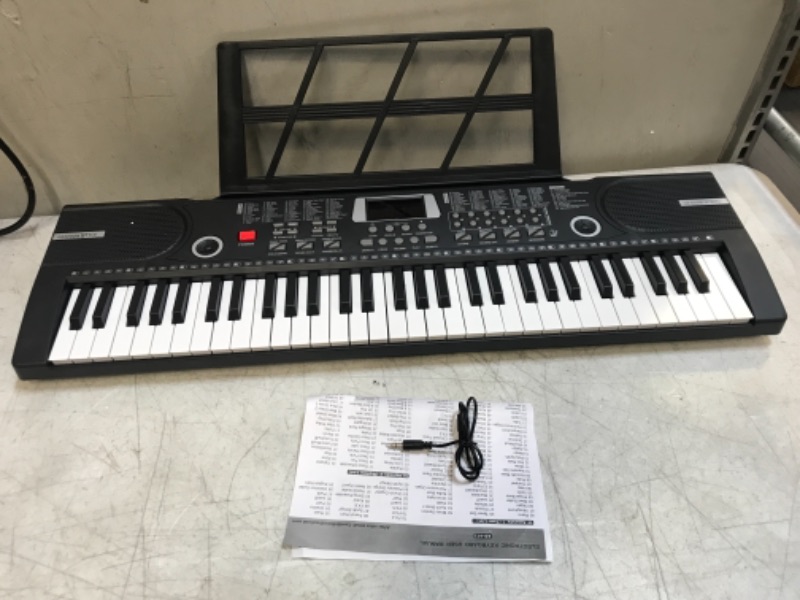 Photo 3 of Camide 61 Keys Keyboard Piano, Electronic Digital Piano with Built-In Speaker Microphone, Sheet Stand and Power Supply, Portable Keyboard Gift Teaching for Beginners Black ** UNABLE TO TEST // NEEDS BATTERIES ** 
