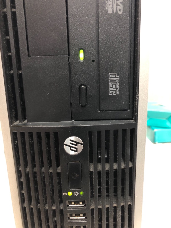 Photo 1 of HP COMPAQ 8200 ELITE SMALL FORM FACTOR PC COMES WITH KEYBOARD , MOUSE & USB ADAPTER ** UNABLE TO TEST / MISSING PCS ARE UNKNOWN / LEVER TO OPEN PC DOES NOT WORK / DENTING IN THE BACK ** 