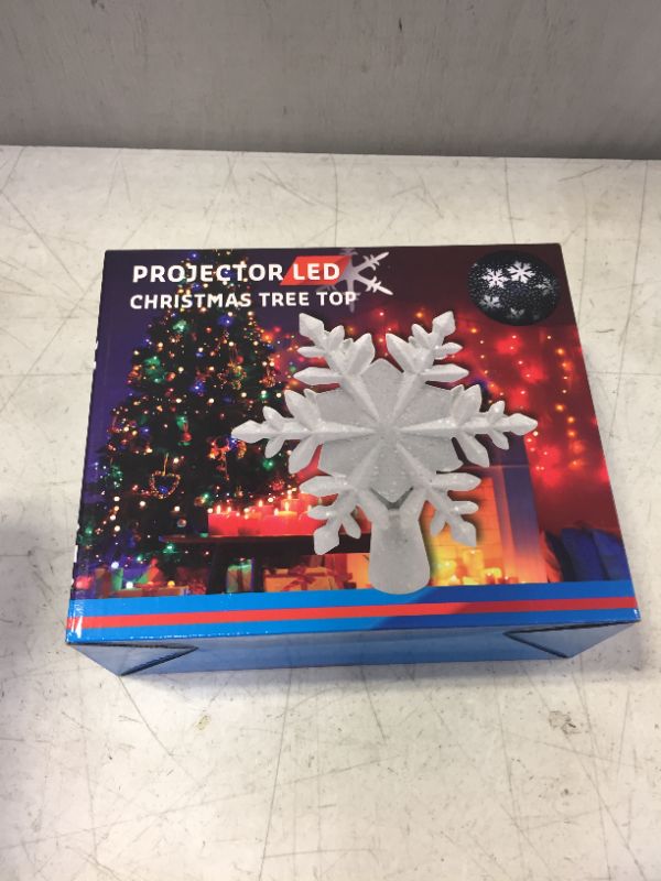 Photo 1 of Christmas Tree Topper,Snow Christmas Tree Topper Lighted with LED Rotating Snowflake Projector ,3D Glittered Tree Night Light Christmas Tree Decorations(Silver-White Snowflakes) Snow-silver-white Snowflakes