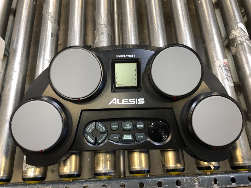 Photo 2 of Alesis Compact Kit 4 – Tabletop Electric Drum Set with 70 Electronic / Acoustic Drum Kit Sounds, 4 Pads, Battery- or Ac-power and Drum Sticks Included