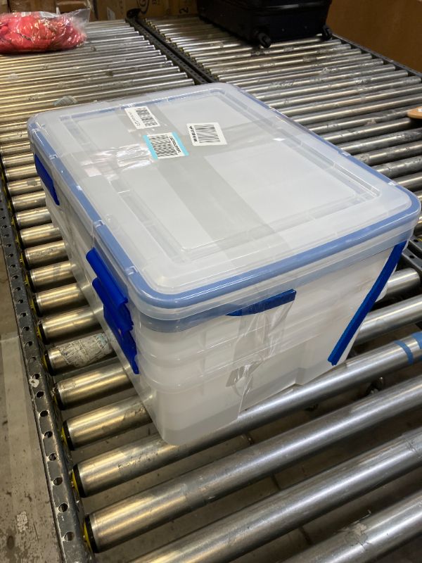 Photo 2 of IRIS USA 30 Quart WEATHERPRO Plastic Storage Box with Durable Lid and Seal and Secure Latching Buckles, Clear With Blue Buckles, Weathertight, 3 Pack 30 Quart - 3 Pack