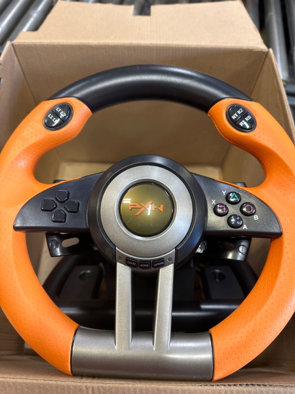 Photo 2 of Game Racing Wheel, PXN-V3II 180° Competition Racing Steering Wheel with Universal USB Port and with Pedal, Suitable for PC, PS3, PS4, Xbox One, Xbox Series S&X, Nintendo Switch - Orange