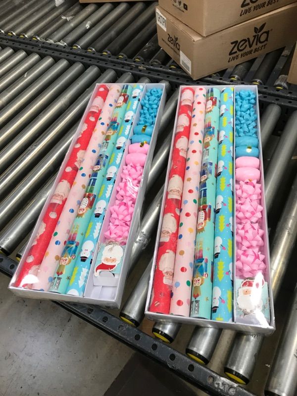 Photo 3 of 2----Wrapping Paper, Christmas Wrapping Paper for Kids Boys, Girls, baby. 4 Cute Designs Including Santa, Christmas Lights, Snowman, Nutcracker. Includes Decorative Flowers, Ribbons, Labels. Each Roll of Gift Wrap Paper Measures 27.5 In X 13 ft