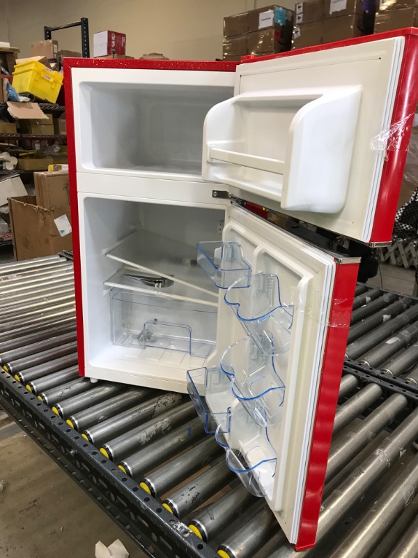 Photo 2 of Frigidaire EFR840-RED 3.1 Cu Ft Red 2 Door Retro Bar Fridge with Side Bottle Opener missing side bottle opener ---minor dents 
