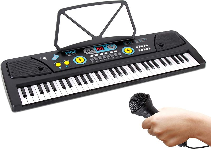 Photo 1 of Digital Piano Kids Keyboard - Portable 61 Key Piano Keyboard, Learning Keyboard for Beginners w/ Drum Pad, Recording, Microphone, Music Sheet Stand, Built-in Speaker - Pyle PKBRD6111 , Black
