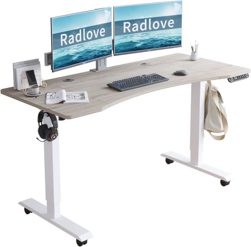 Photo 1 of Radlove Electric Standing Desk, 55 x 30 Height Adjustable Computer Desk Sit Stand Desk Home Office Desks with Splice Board and A Under Desk Cable Management Tray (White Frame + Oak Top)---the box is minor damage the item inside is good and new 
