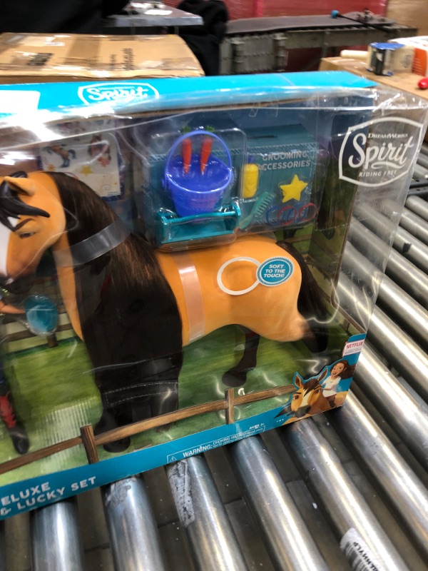 Photo 2 of DreamWorks Spirit Riding Free Deluxe 14 Inch Spirit Horse and 11.5 Inch Lucky Doll Set with Accessories, by Just Play