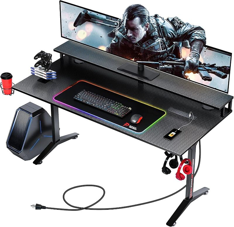 Photo 1 of SEVEN WARRIOR Gaming Desk 55INCH with RGB Mouse Pad & Power Outlet, Carbon Fiber Surface Gamer Desk with Monitor Stand, Ergonomic Y Shaped Gamer Table with Cup Holder, Headphone Hook, Outlet Organizer ----***** TABLE TOP CORNERS DAMAGED / SELL FOR PARTS 