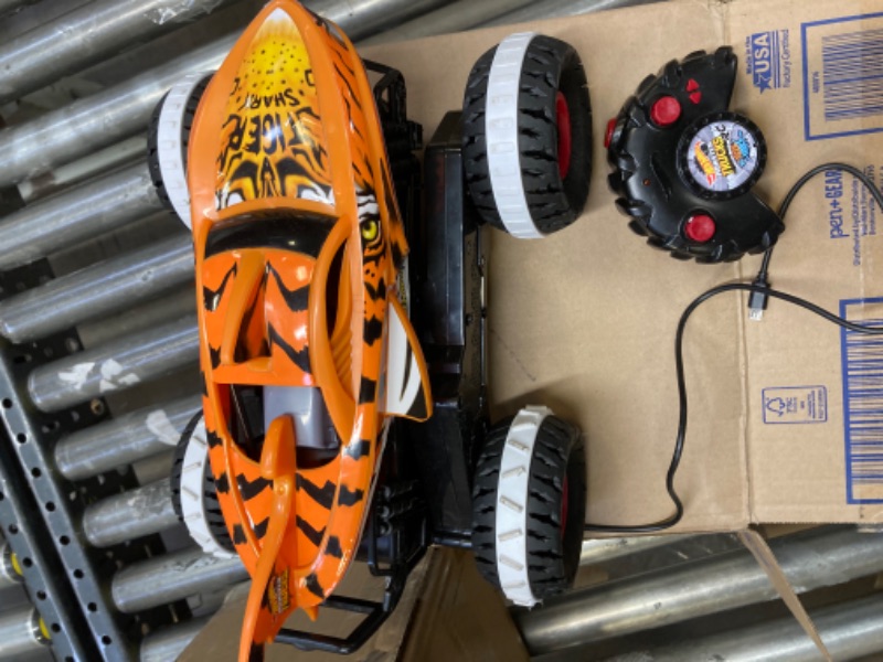 Photo 4 of Hot Wheels Monster Trucks, *UNABLE TO TEST*  Remote Control Car, Monster Truck Toy with All-Terrain Wheels, 1:15 Scale Unstoppable Tiger Shark RC