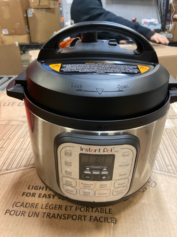 Photo 2 of Instant Pot Duo 7-in-1 Electric Pressure Cooker, DENTED 