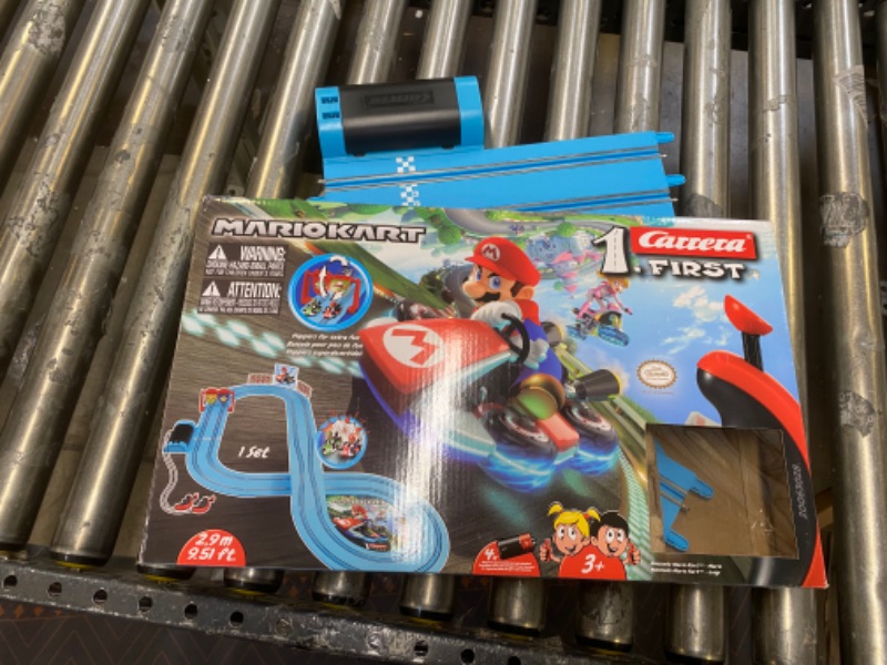 Photo 2 of Carrera First Nintendo Mario Kart Slot Car Race Track - Includes 2 Cars: Mario and Luigi and Two-Controllers - Battery-Powered Beginner Set for Kids Ages 3 Years and Up, 20063028 Mario Kart / Flippers