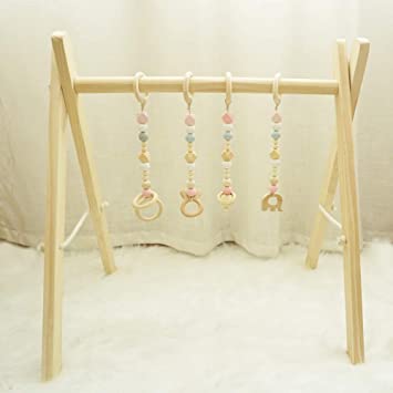 Photo 1 of Baby Foldable Wooden Play Gym with 4 Theething Gym Toys Frame Activity Gym Natural Hanging Bar Newborn Gift Baby Girl and Boy Gym ++NOT EXACT ITEM BUT SIMILAR/EXAMPLE++