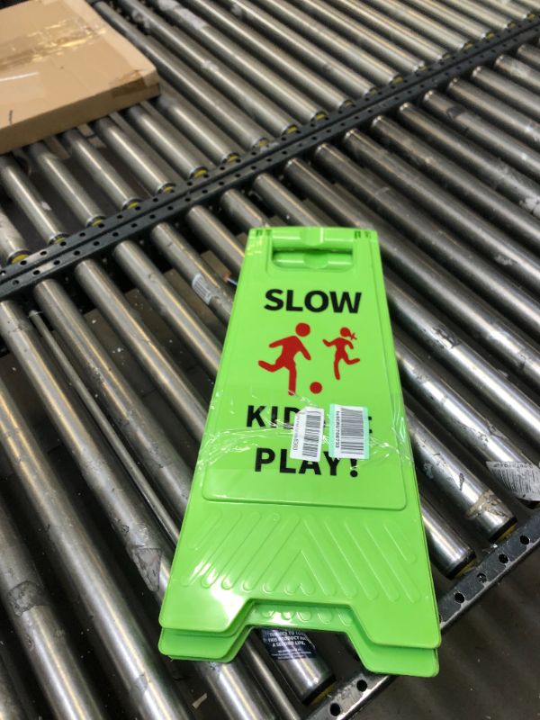 Photo 2 of Slow Kids at Play Sign, Children at Play Safety Signs with Double-Sided Text and Graphics for Street Neighborhoods Schools Park Sidewalk Driveway (2-Pack Green)  --- No Box Packaging, Minor Use
