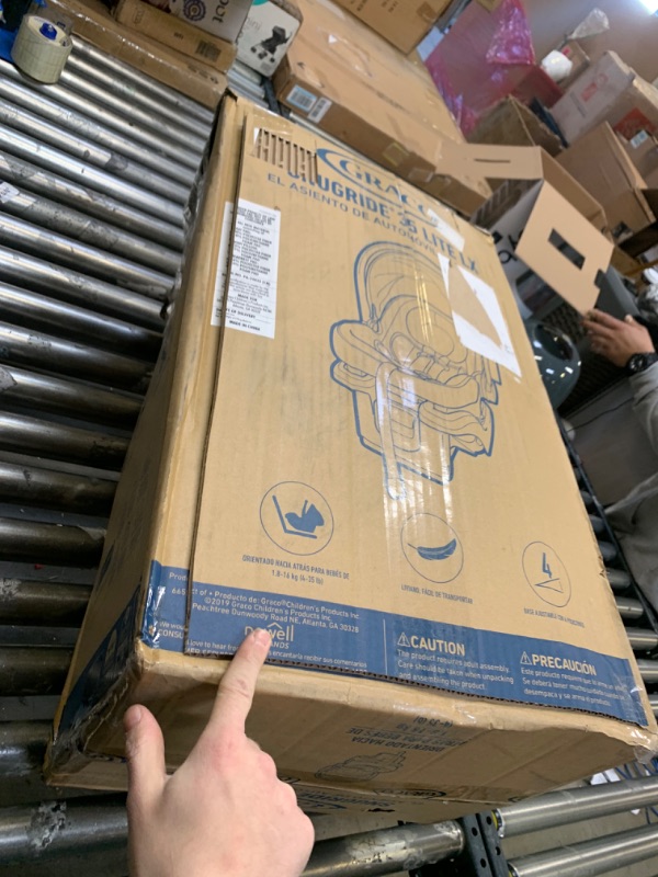 Photo 2 of Graco SnugRide 35 Lite LX Infant Car Seat,  --- Box Packaging Damaged, Moderate Use, Scratches and Scuffs on Plastic, Dirty From Previous Use
