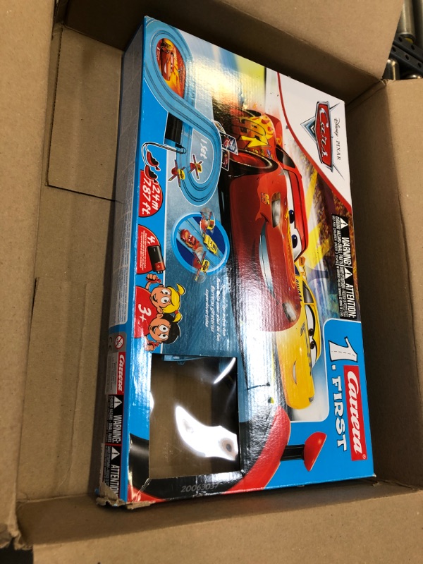 Photo 2 of Carrera First Disney/Pixar Cars - Slot Car Race Track - Includes 2 Cars: Lightning McQueen and Dinoco Cruz - Battery-Powered Beginner Racing Set for Kids Ages 3 Years and Up Disney Cars w/ Spinners