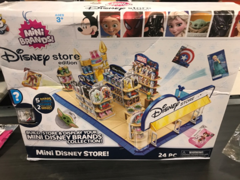 Photo 2 of 5 Surprise Mini Brands Disney Toy Store Playset by Zuru - Disney Toy Store Includes 5 Exclusive Mystery Mini's, Store and Display Mini Collectibles, Toy for Kids, Teens, and Adults
