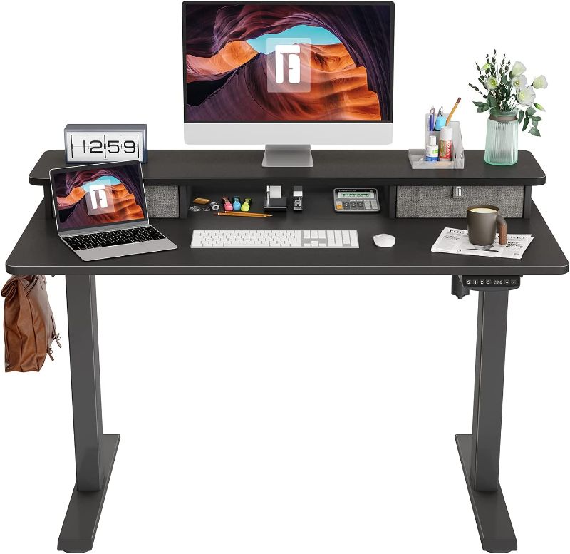 Photo 1 of NOT A COMPLETE SET MISSING OTHER BOX DESK ONLY NOT FRAME 
FEZIBO Height Adjustable Electric Standing Desk with Double Drawer, 55 Inch Stand Up Table with Storage Shelf, Sit Stand Desk with Splice Board, Black Frame/Black Top
