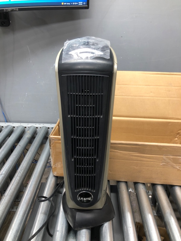 Photo 2 of ***PARTS ONLY ITEM DOES NOT TURN ON*** Lasko Oscillating Ceramic Tower Space Heater for Home with Adjustable Thermostat, Timer and Remote Control, 22.5 Inches, Grey/Black, 1500W, 751320