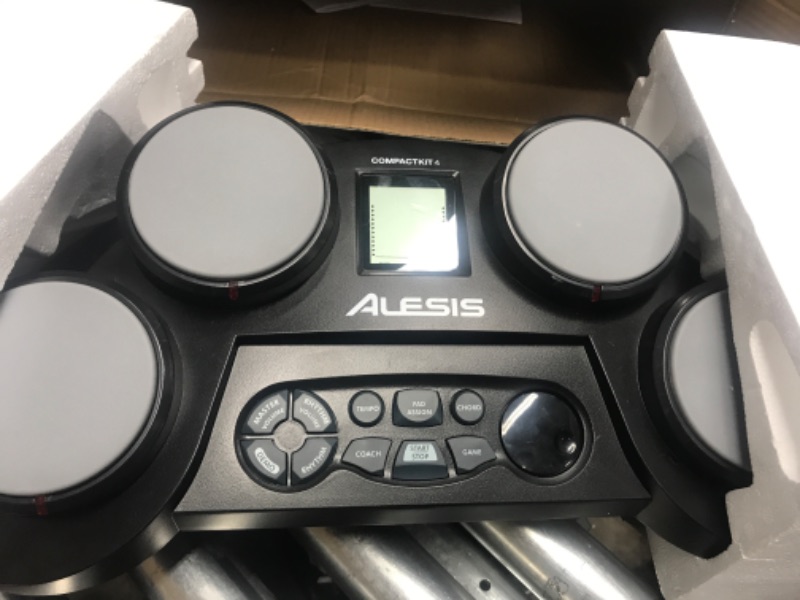 Photo 2 of *** POWERS ON *** Alesis Compact Kit 4 – Tabletop Electric Drum Set with 70 Electronic / Acoustic Drum Kit Sounds, 4 Pads, Battery- or Ac-power and Drum Sticks Included