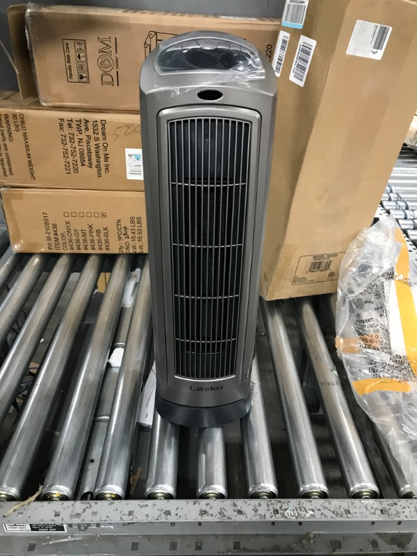 Photo 2 of *USED*Lasko Oscillating Digital Ceramic Tower Heater for Home with Adjustable Thermostat, Timer and Remote Control, 23 Inches, 1500W, Silver, 755320