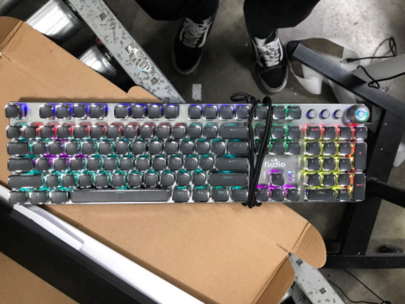 Photo 1 of Fiodio Mechanical Gaming Keyboard with Blue Switches, Removable Hand Rest, LED Rainbow Gaming Backlit