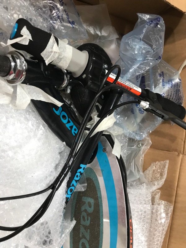 Photo 1 of Razor E100 Electric Scooter for Kids Ages 8+ - 8" Pneumatic Front Tire, Hand-Operated Front Brake, Up to 10 mph and 40 min of Ride Time, For Riders up...

