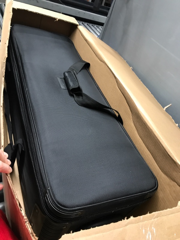 Photo 1 of 13x40 inch black rolling upright case