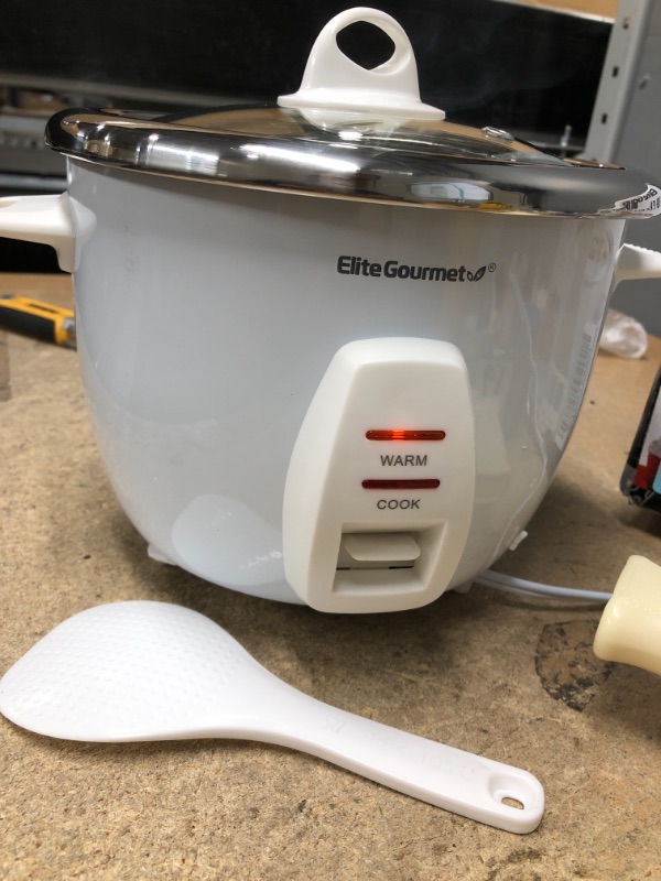 Photo 2 of **ONE LEG IS LOOSE, NEEDS TO BE ATTACHED**
Elite Gourmet ERC-2010 Electric Rice Cooker with Stainless Steel Inner Pot Makes Soups, Stews, Grains, Cereals, Keep Warm Feature, 10 cups cooked (5 Cups uncooked), White
