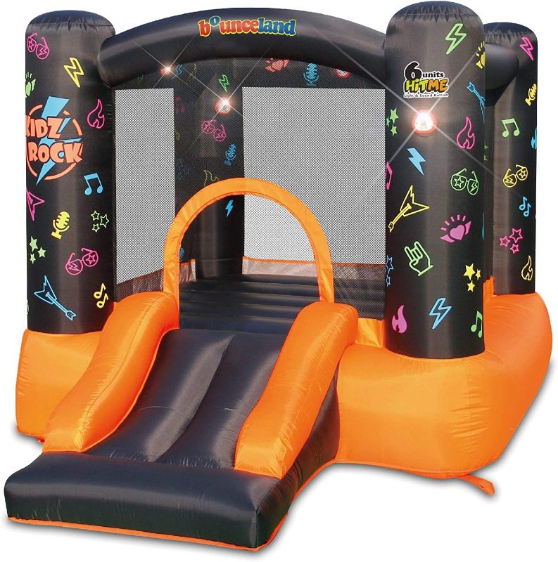 Photo 1 of ***BLOWER TESTED POWERED ON***Kidz Rock Bounce House with Lights and Sound Interaction Inflatable Bouncer, 9 ft L x 7 ft W x 5.5 ft H, Music and Lights for Kids Play, Blower Included, Netted for Safety, Fun for Kids