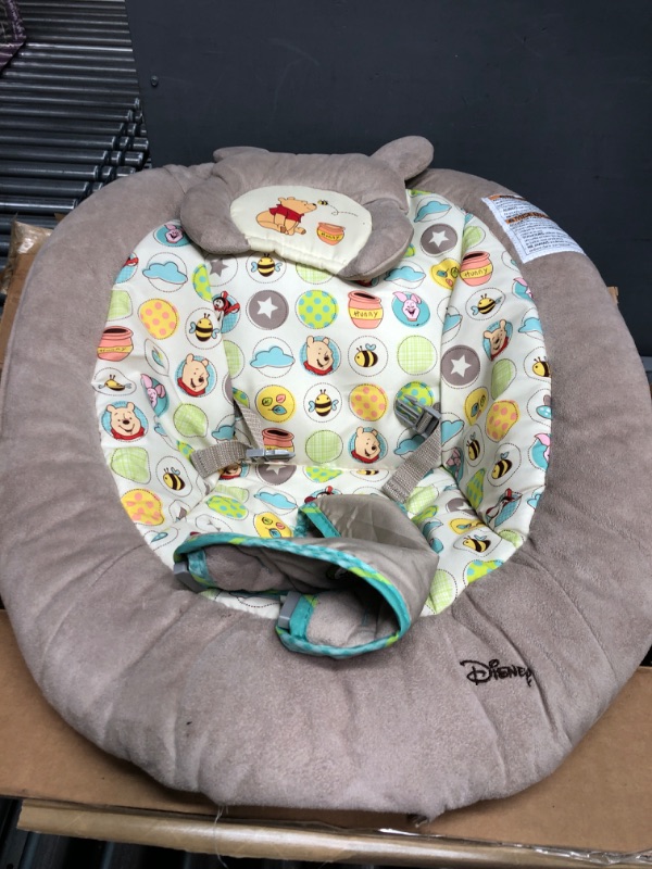 Photo 2 of Bright Starts Winnie the Pooh Dots & Hunny Pots Baby Bouncer with Vibrating Infant Seat, Music & 3 Playtime Toys, 23x19x23 Inch
