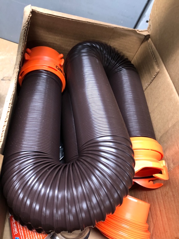 Photo 2 of Camco 20' (39742) RhinoFLEX 20-Foot RV Sewer Hose Kit, Swivel Transparent Elbow with 4-in-1 Dump Station Fitting-Storage Caps Included , Black , Brown 20ft Sewer Hose Kit Frustration-Free Packaging