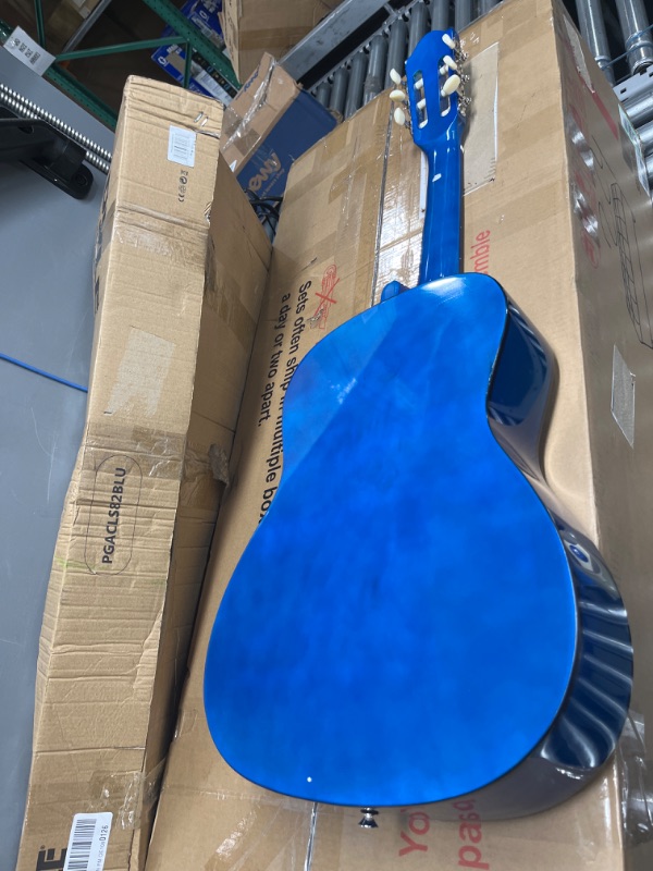 Photo 2 of **MISSING ACCESSORIES**
Beginner 36” Classical Acoustic Guitar - 3/4 Junior Size 6 String Linden Wood Guitar w/ Gig Bag, Tuner, Nylon Strings, Picks, Strap, For Beginners, Adults - Pyle PGACLS82BLU (Blue Burst) Blue Fade Blue Fade Guitar