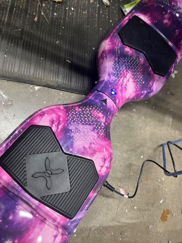 Photo 2 of **ONLY POWERS ON WHEN PLUGGED INTO POWER OUTLET**
ver-1 Helix Electric Hoverboard | 7MPH Top Speed, 4 Mile Range, 6HR Full-Charge, Built-in Bluetooth Speaker, Rider Modes: Beginner to Expert Hoverboard Galaxy