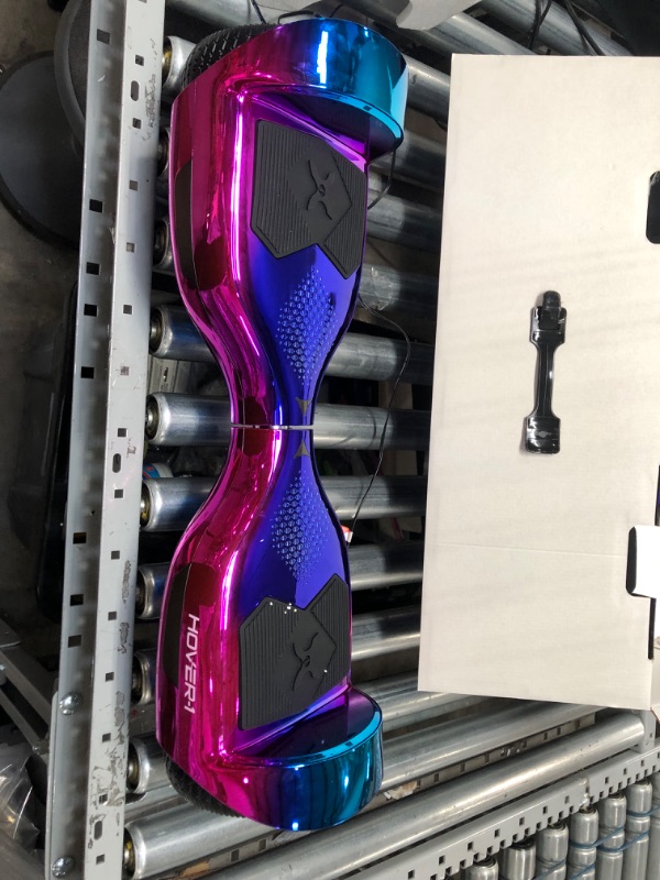 Photo 2 of **NONFUNCTIONAL**
Hover-1 Helix Electric Hoverboard | 7MPH Top Speed, 4 Mile Range, 6HR Full-Charge, Built-in Bluetooth Speaker, Rider Modes: Beginner to Expert Hoverboard Iridescent
