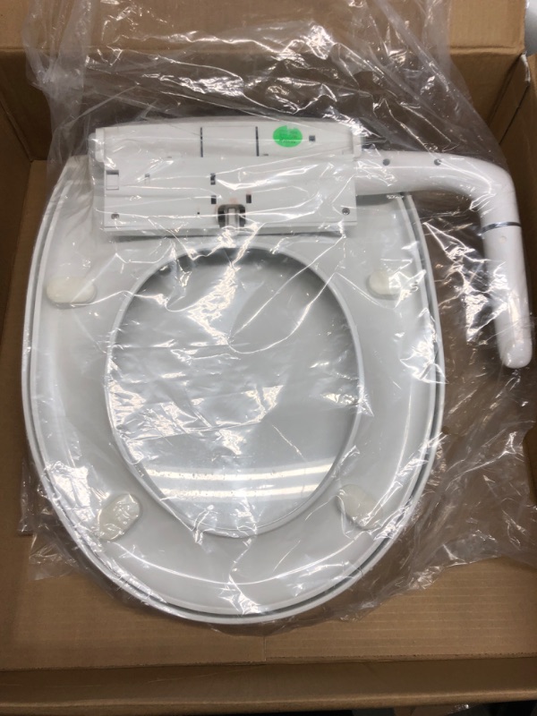 Photo 2 of *Loose Hardware/Possibly Missing* Kohler 76923-0 Puretide Toliet Seat, Round Manual Non Electric Bidet with Adjusting Spray Pressure and Position, Quiet-Close Lid, White White Round Toilet Seat