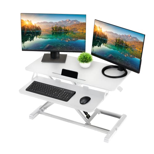 Photo 1 of TechOrbits Standing Desk Converter - 32 Inch Particle Board, Adjustable Height Sit to Stand Up Desk Riser for Home Office - Computer, Laptop & Dual Monitor Workstation - White
