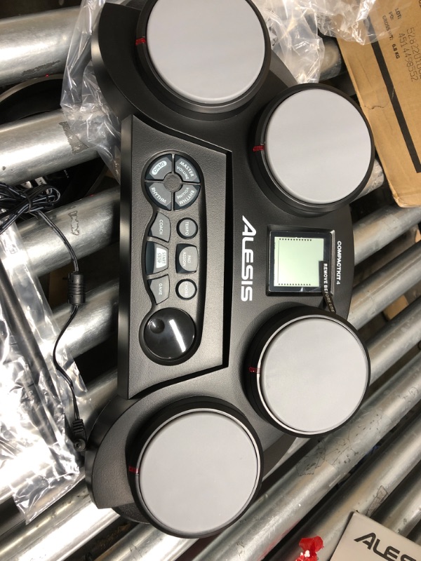 Photo 3 of *** POWERS ON *** Alesis Compact Kit 4 – Tabletop Electric Drum Set with 70 Electronic / Acoustic Drum Kit Sounds, 4 Pads, Battery- or Ac-power and Drum Sticks Included