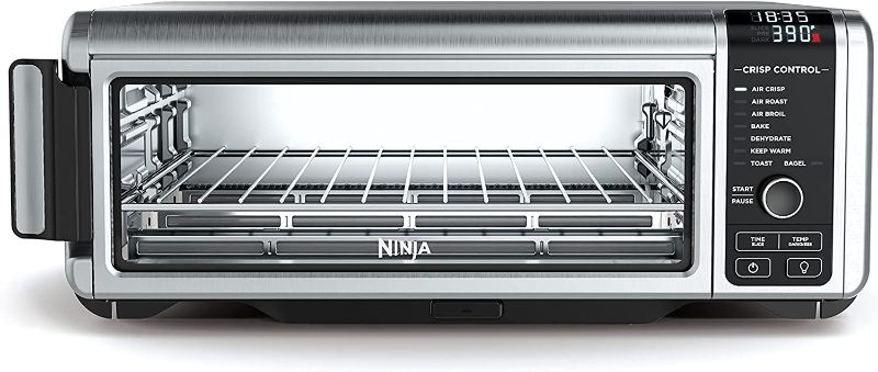 Photo 2 of *** POWERS ON *** Ninja SP101 Digital Air Fry Countertop Oven with 8-in-1 Functionality, Flip Up & Away Capability for Storage Space, with Air Fry Basket, Wire Rack & Crumb Tray, Silver
