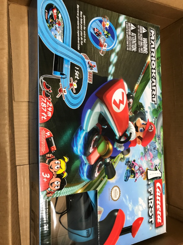 Photo 2 of Carrera First Mario Kart - Slot Car Race Track With Spinners - Includes 2 Cars: Mario and Yoshi - Battery-Powered Beginner Racing Set for Kids Ages 3 Years and Up Mario Kart w/ Spinners